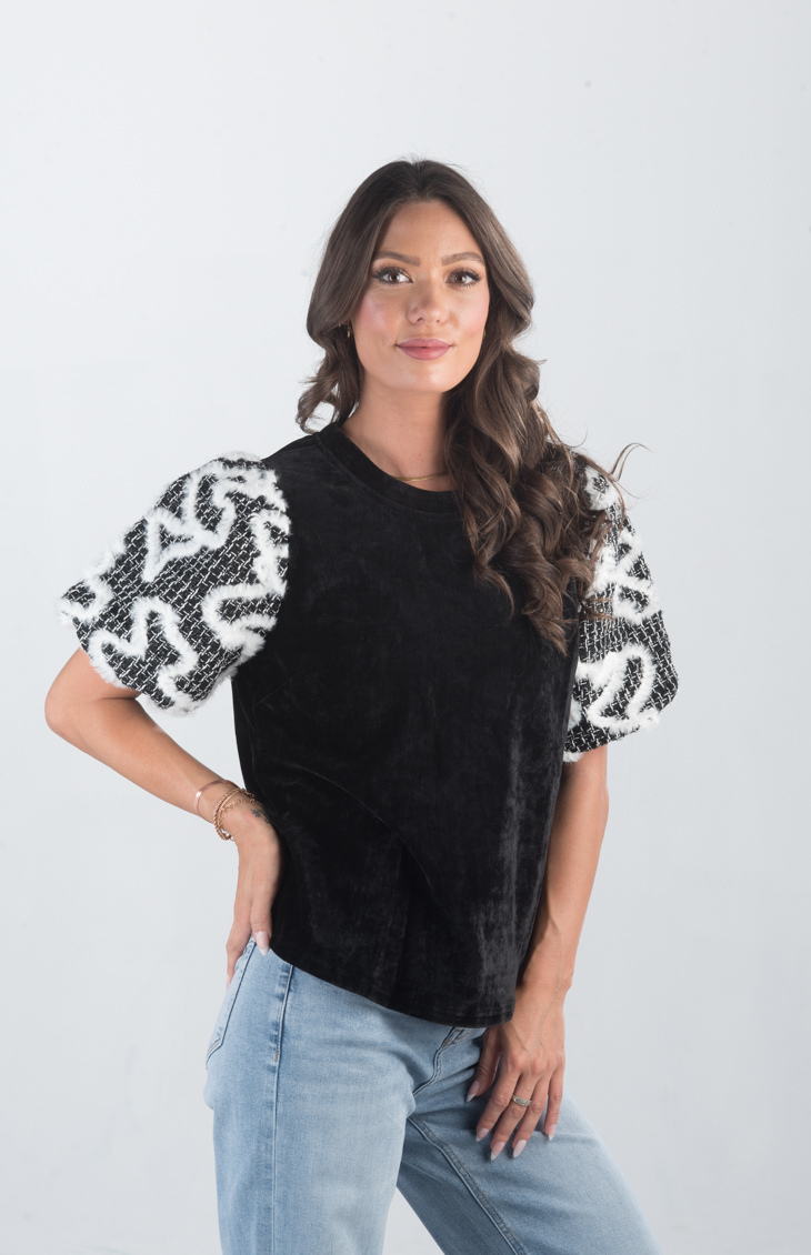 Introducing the Spirit Week Top, a striking black velvet top that brings together bold design and playful details. Featuring puffy sleeves adorned with white feather ruffles, this top is perfect for making a statement and adding a touch of drama to your outfit.
Fabric: Information not provided
Size Guide: Fits True To Size, Model is Wearing a Size S
Available at our boutiques in Chicago, Lake Geneva, and Milwaukee. (Item availability may vary by location.)