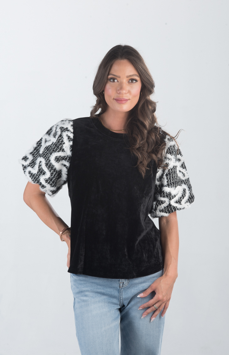 Introducing the Spirit Week Top, a striking black velvet top that brings together bold design and playful details. Featuring puffy sleeves adorned with white feather ruffles, this top is perfect for making a statement and adding a touch of drama to your outfit.
Fabric: Information not provided
Size Guide: Fits True To Size, Model is Wearing a Size S
Available at our boutiques in Chicago, Lake Geneva, and Milwaukee. (Item availability may vary by location.)