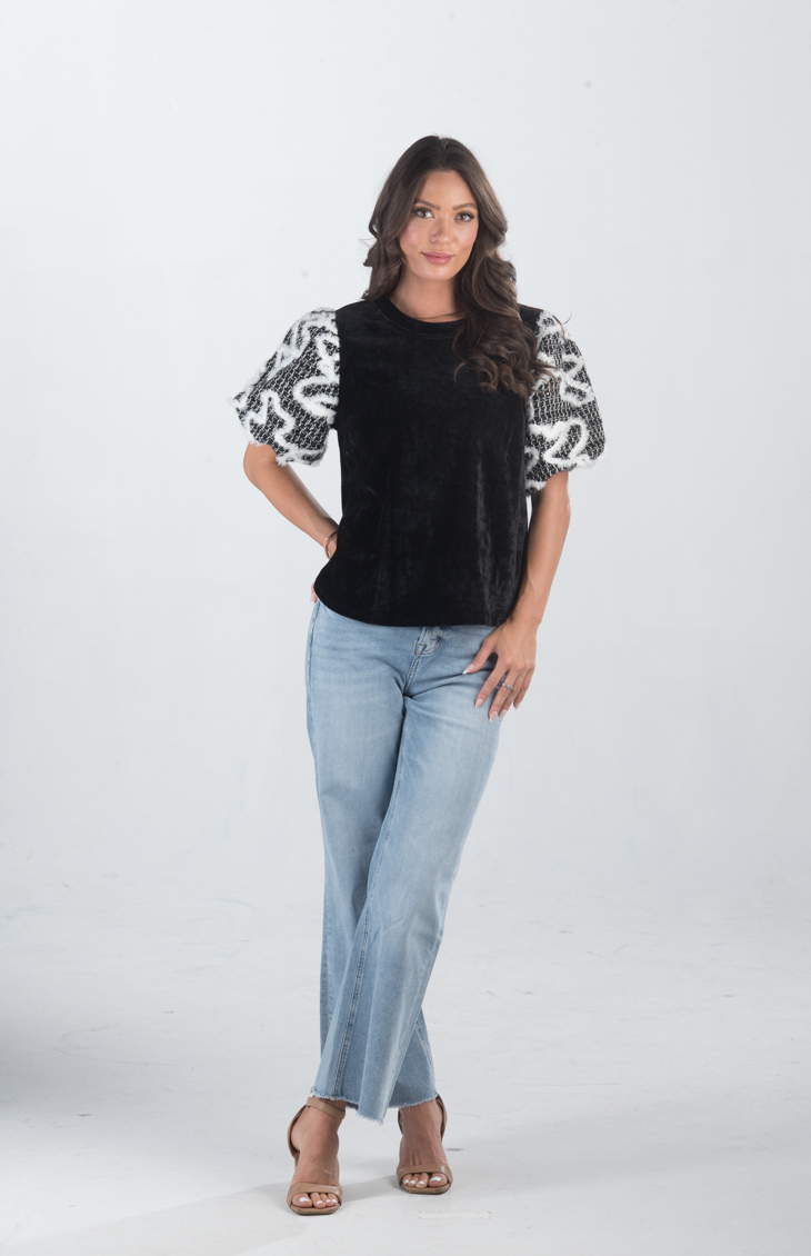 Introducing the Spirit Week Top, a striking black velvet top that brings together bold design and playful details. Featuring puffy sleeves adorned with white feather ruffles, this top is perfect for making a statement and adding a touch of drama to your outfit.
Fabric: Information not provided
Size Guide: Fits True To Size, Model is Wearing a Size S
Available at our boutiques in Chicago, Lake Geneva, and Milwaukee. (Item availability may vary by location.)