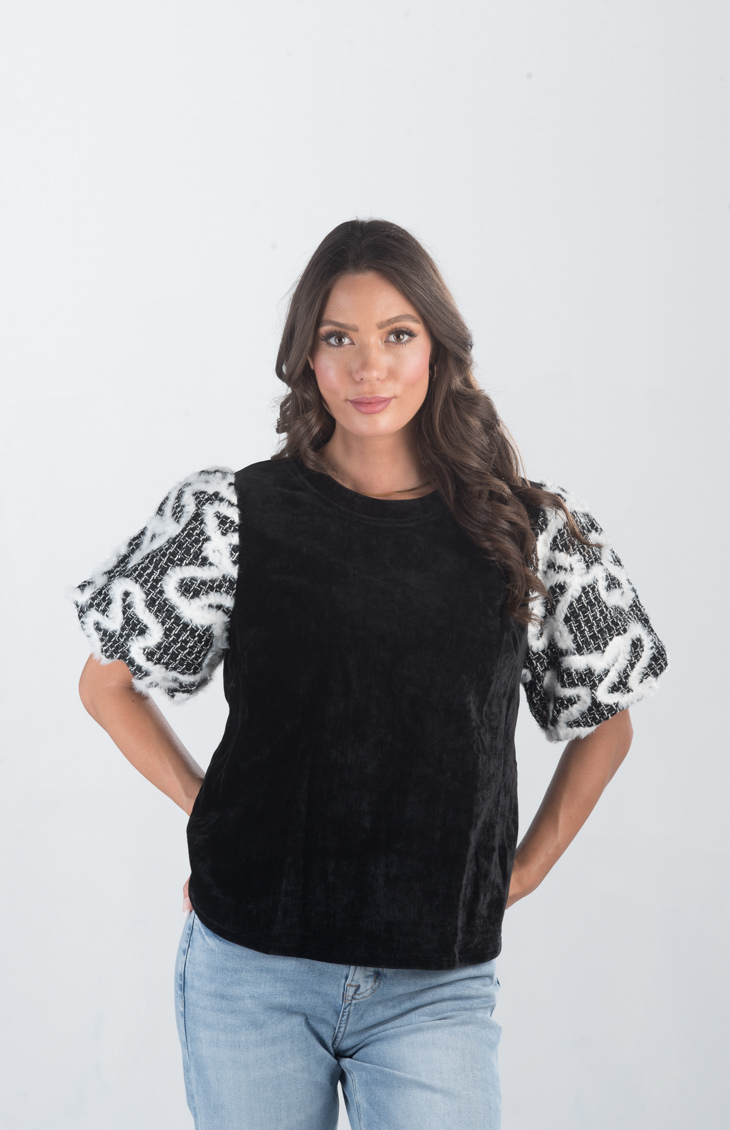 Introducing the Spirit Week Top, a striking black velvet top that brings together bold design and playful details. Featuring puffy sleeves adorned with white feather ruffles, this top is perfect for making a statement and adding a touch of drama to your outfit.
Fabric: Information not provided
Size Guide: Fits True To Size, Model is Wearing a Size S
Available at our boutiques in Chicago, Lake Geneva, and Milwaukee. (Item availability may vary by location.)