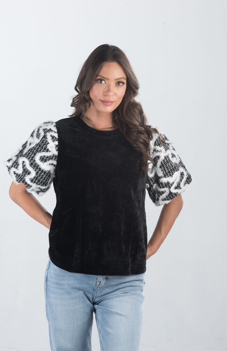 Introducing the Spirit Week Top, a striking black velvet top that brings together bold design and playful details. Featuring puffy sleeves adorned with white feather ruffles, this top is perfect for making a statement and adding a touch of drama to your outfit.
Fabric: Information not provided
Size Guide: Fits True To Size, Model is Wearing a Size S
Available at our boutiques in Chicago, Lake Geneva, and Milwaukee. (Item availability may vary by location.)