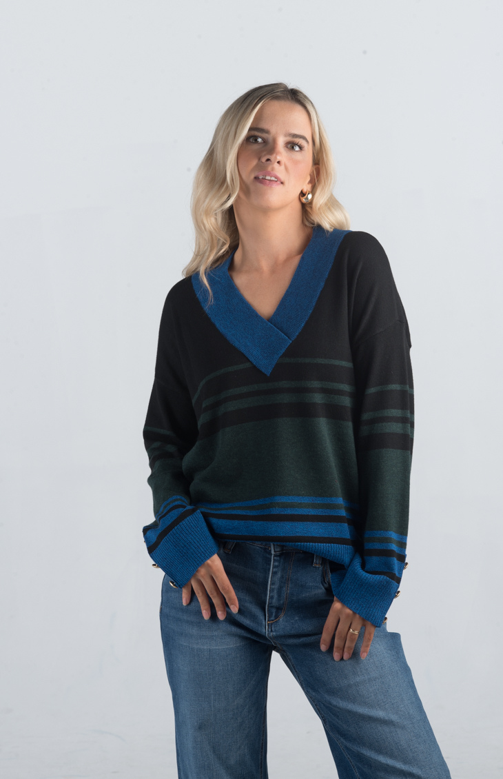 Introducing the Double or Nothing Sweater, a striking black and blue striped sweater that effortlessly combines bold design with elegance. Featuring a v-neckline and gold button detailing on the sleeves, this long-sleeved sweater is perfect for adding a touch of sophistication to your wardrobe.
Fabric: 54% Polyester, 20% Acrylic, 20% Nylon, 6% Wool
Size Guide: Fits True To Size, Model is Wearing a Size S
Available at our boutiques in Chicago, Lake Geneva, and Milwaukee. (Item availability may vary by loc