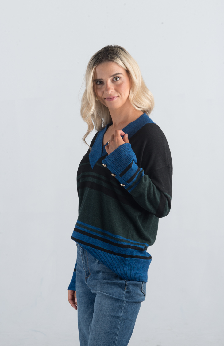 Introducing the Double or Nothing Sweater, a striking black and blue striped sweater that effortlessly combines bold design with elegance. Featuring a v-neckline and gold button detailing on the sleeves, this long-sleeved sweater is perfect for adding a touch of sophistication to your wardrobe.
Fabric: 54% Polyester, 20% Acrylic, 20% Nylon, 6% Wool
Size Guide: Fits True To Size, Model is Wearing a Size S
Available at our boutiques in Chicago, Lake Geneva, and Milwaukee. (Item availability may vary by loc