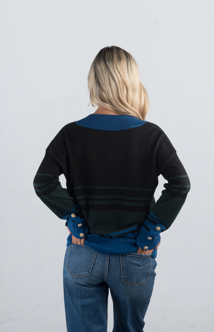 Introducing the Double or Nothing Sweater, a striking black and blue striped sweater that effortlessly combines bold design with elegance. Featuring a v-neckline and gold button detailing on the sleeves, this long-sleeved sweater is perfect for adding a touch of sophistication to your wardrobe.
Fabric: 54% Polyester, 20% Acrylic, 20% Nylon, 6% Wool
Size Guide: Fits True To Size, Model is Wearing a Size S
Available at our boutiques in Chicago, Lake Geneva, and Milwaukee. (Item availability may vary by loc