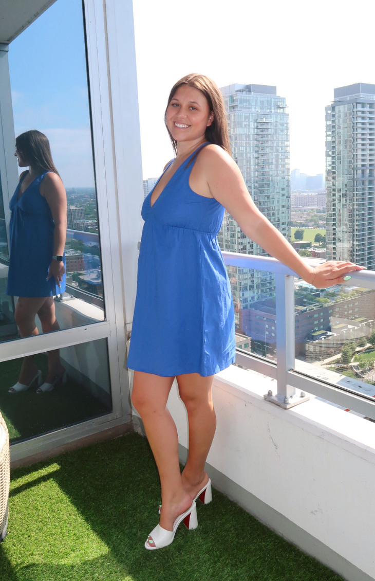 Blue linen V-neck mini dress from our boutique in Chicago, Lake Geneva, and Milwaukee. Perfect for a casual and stylish summer look.