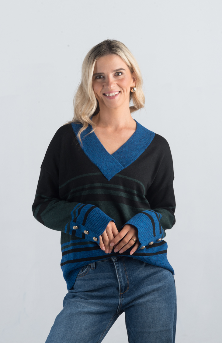 Introducing the Double or Nothing Sweater, a striking black and blue striped sweater that effortlessly combines bold design with elegance. Featuring a v-neckline and gold button detailing on the sleeves, this long-sleeved sweater is perfect for adding a touch of sophistication to your wardrobe.

Fabric: 54% Polyester, 20% Acrylic, 20% Nylon, 6% Wool

Size Guide: Fits True To Size, Model is Wearing a Size S

Available at our boutiques in Chicago, Lake Geneva, and Milwaukee. (Item availability may vary by loc