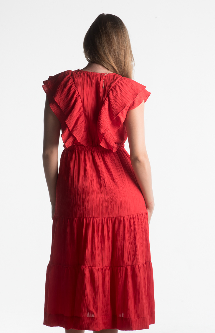 Red midi dress with ruffle sleeves and V-neckline from our boutique in Chicago, Lake Geneva, and Milwaukee. Perfect for a chic and elegant look.