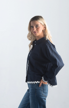 Introducing the Polly Blouse, a stylish navy blouse featuring playful white squiggly stripes. This button-down, collared blouse with long sleeves offers a timeless look, perfect for both casual and professional settings.

Fabric: 100% Cotton

Size Guide: Fits True To Size, Model is Wearing a Size S

Available at our boutiques in Chicago, Lake Geneva, and Milwaukee. (Item availability may vary by location.)