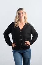 Introducing the It Takes Passion Cardigan, a stylish black button-down cardigan with a twist. The back features a silky material with a beautiful print design, adding an element of surprise and elegance to this cozy piece. Perfect for adding a unique touch to your outfit.

Fabric: 54% Polyester, 20% Acrylic, 20% Nylon, 6% Wool

Size Guide: Fits True To Size, Model is Wearing a Size S

Available at our boutiques in Chicago, Lake Geneva, and Milwaukee. (Item availability may vary by location.)