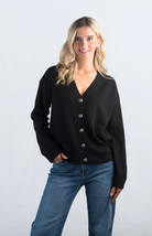 Introducing the It Takes Passion Cardigan, a stylish black button-down cardigan with a twist. The back features a silky material with a beautiful print design, adding an element of surprise and elegance to this cozy piece. Perfect for adding a unique touch to your outfit.

Fabric: 54% Polyester, 20% Acrylic, 20% Nylon, 6% Wool

Size Guide: Fits True To Size, Model is Wearing a Size S

Available at our boutiques in Chicago, Lake Geneva, and Milwaukee. (Item availability may vary by location.)