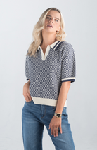 Introducing the Aristotle Top, a refined navy and cream printed top that exudes timeless sophistication. Featuring short sleeves and a classic collar, this top is perfect for elevating your casual or professional wardrobe.

Fabric: 100% Cotton

Size Guide: Fits True To Size, Model is Wearing a Size S

Available at our boutiques in Chicago, Lake Geneva, and Milwaukee. (Item availability may vary by location.)