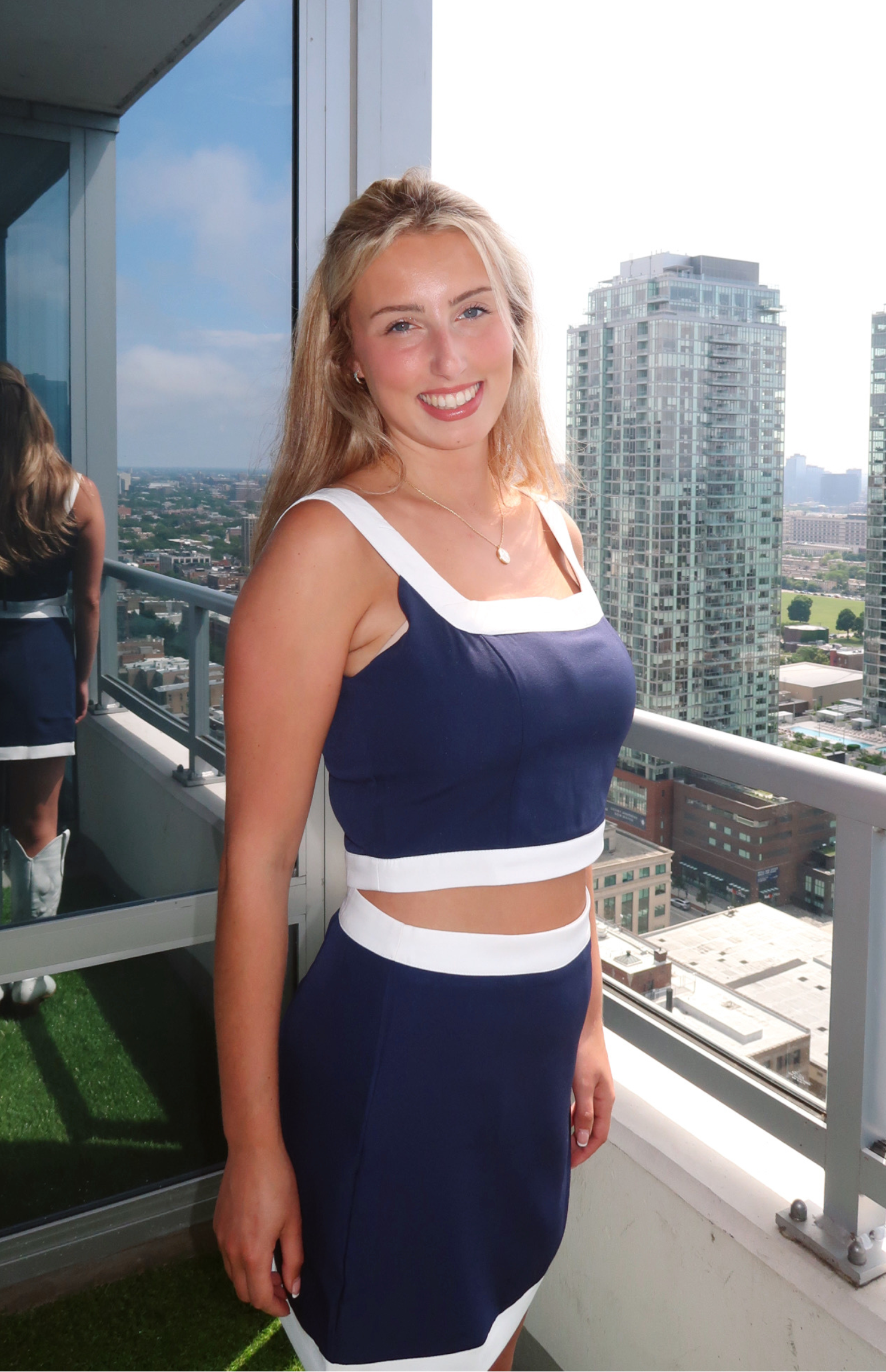 Dallas Cowboys-inspired matching set with a blue crop top and skirt featuring white trim from our boutique in Chicago, Lake Geneva, and Milwaukee. Perfect for a sporty and stylish look.