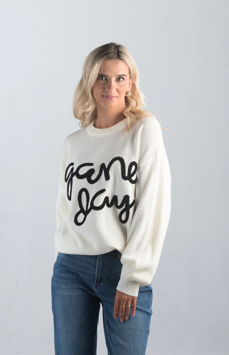 Game Day Sweater

Casual and Fun for Any Occasion

Introducing the Game Day Sweater, a playful white sweater perfect for showing off your team spirit. Featuring bold "Game Day" text, this cozy sweater is ideal for sporting events, casual outings, or just relaxing in style.

Fabric: 100% Acrylic

Size Guide: Fits True To Size, Model is Wearing a Size S

Available at our boutiques in Chicago, Lake Geneva, and Milwaukee. (Item availability may vary by location.)