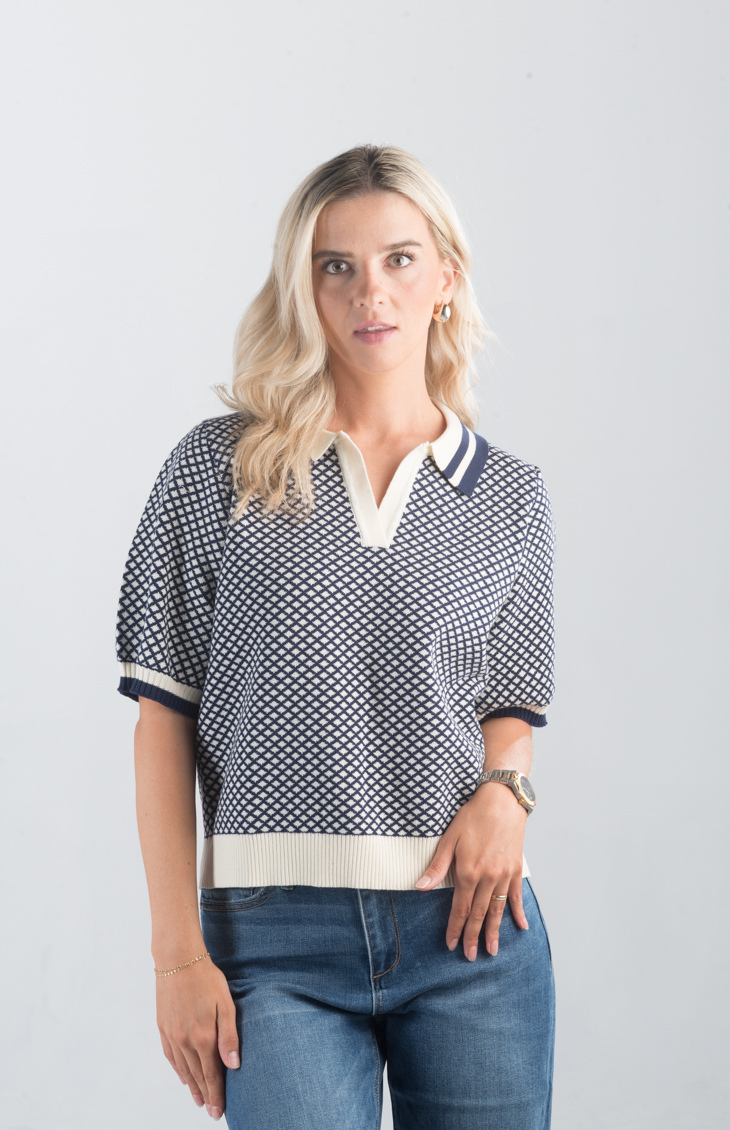 Introducing the Aristotle Top, a refined navy and cream printed top that exudes timeless sophistication. Featuring short sleeves and a classic collar, this top is perfect for elevating your casual or professional wardrobe.

Fabric: 100% Cotton

Size Guide: Fits True To Size, Model is Wearing a Size S

Available at our boutiques in Chicago, Lake Geneva, and Milwaukee. (Item availability may vary by location.)