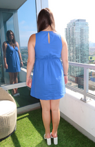 Blue linen V-neck mini dress from our boutique in Chicago, Lake Geneva, and Milwaukee. Perfect for a casual and stylish summer look.