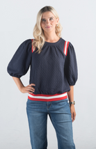 Something Like That Top

Chic and Comfortable for Any Occasion

Introducing the Something Like That Top, a stylish navy top featuring puff sleeves and red and white stripe detailing. Made from a textured soft material, this top is perfect for adding a touch of chic elegance to your everyday wardrobe.

Fabric: 97% Polyester, 3% Spandex

Size Guide: Fits True To Size, Model is Wearing a Size S

Available at our boutiques in Chicago, Lake Geneva, and Milwaukee. (Item availability may vary by location.)