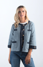 Introducing the A Little Dramatic Cardigan, a chic slate blue light jacket that combines style with subtle drama. Featuring gold button detailing and navy accents on the hem, this cardigan is perfect for adding a sophisticated touch to any outfit.

Fabric: Self: 50% Polyester, 50% Rayon; Contrast: 92% Polyester, 8% Spandex

Size Guide: Fits True To Size, Model is Wearing a Size S

Available at our boutiques in Chicago, Lake Geneva, and Milwaukee. (Item availability may vary by location.)