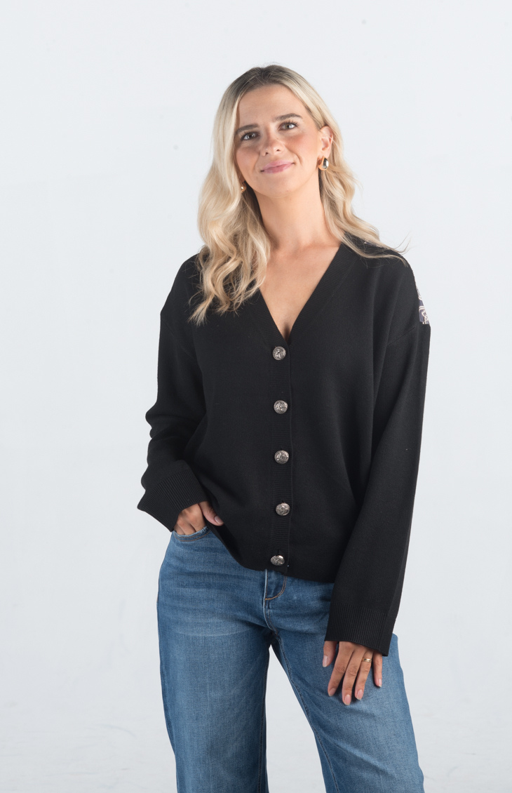 Introducing the It Takes Passion Cardigan, a stylish black button-down cardigan with a twist. The back features a silky material with a beautiful print design, adding an element of surprise and elegance to this cozy piece. Perfect for adding a unique touch to your outfit.

Fabric: 54% Polyester, 20% Acrylic, 20% Nylon, 6% Wool

Size Guide: Fits True To Size, Model is Wearing a Size S

Available at our boutiques in Chicago, Lake Geneva, and Milwaukee. (Item availability may vary by location.)