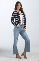 Introducing the Kassidy Striped Cropped Cardigan, a navy and cream striped cardigan that adds a touch of elegance to your wardrobe. This chic cardigan features gold button detailing and a cropped fit, making it perfect for layering or wearing on its own for a polished look.

Fabric: 62% Acrylic, 38% Nylon

Size Guide: Fits True To Size, Model is Wearing a Size S

Available at our boutiques in Chicago, Lake Geneva, and Milwaukee. (Item availability may vary by location.)