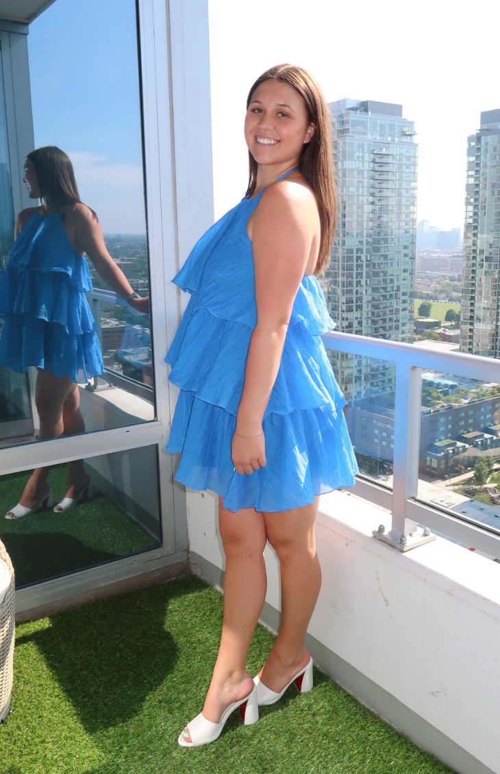 Blue halter dress with tiered ruffles from our boutique in Chicago, Lake Geneva, and Milwaukee. Perfect for a flowy and stylish summer look.