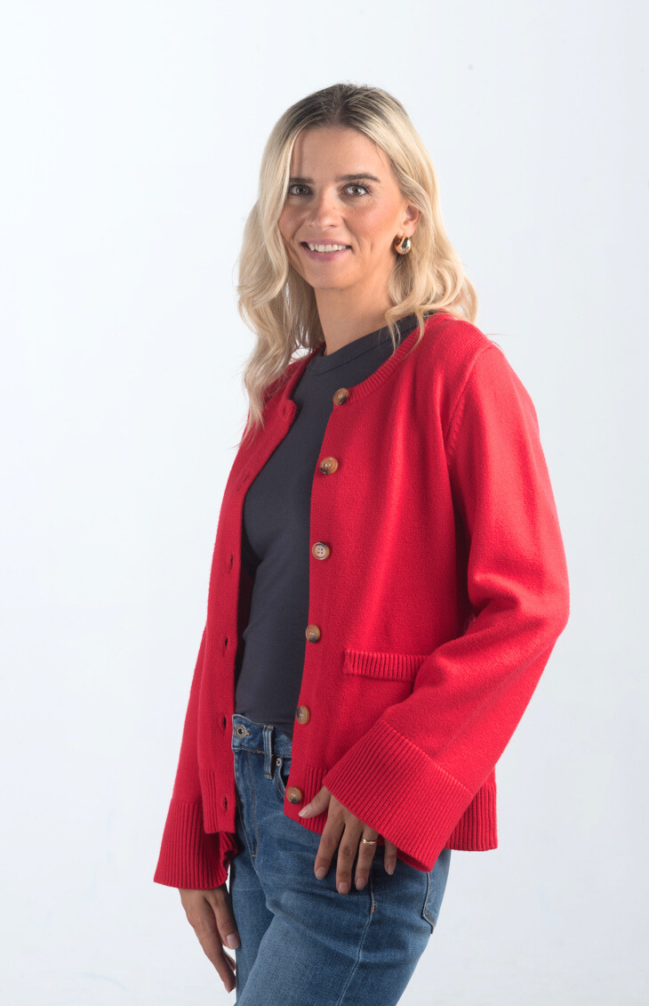 Introducing the Pamelia Wide Sleeve Cardigan, a vibrant red cardigan that effortlessly combines comfort with style. Featuring wide sleeves and a button-up design, this cardigan is perfect for layering and adding a pop of color to your wardrobe.

Fabric: 50% Viscose, 27% Polyester, 23% Polyamide

Size Guide: Fits True To Size, Model is Wearing a Size S

Available at our boutiques in Chicago, Lake Geneva, and Milwaukee. (Item availability may vary by location.)