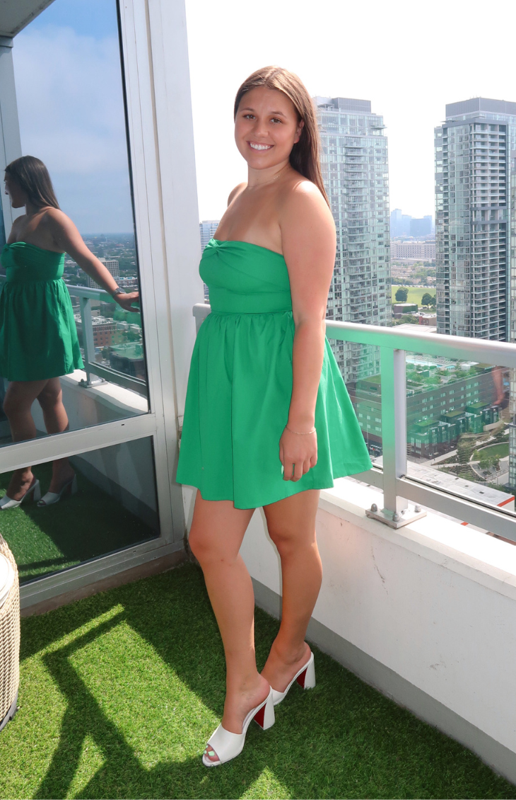 Green strapless mini dress from our boutique in Chicago, Lake Geneva, and Milwaukee. Perfect for a fresh and vibrant summer look.