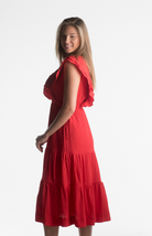 Red midi dress with ruffle sleeves and V-neckline from our boutique in Chicago, Lake Geneva, and Milwaukee. Perfect for a chic and elegant look.