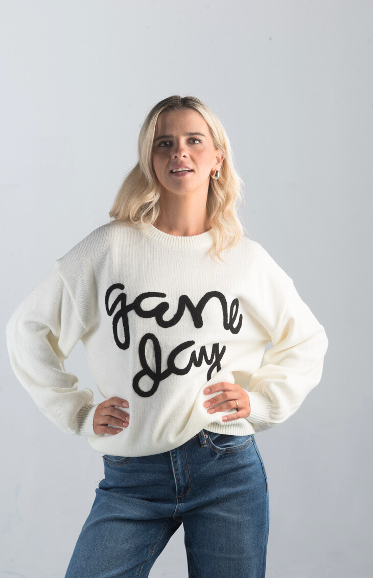 Game Day Sweater

Casual and Fun for Any Occasion

Introducing the Game Day Sweater, a playful white sweater perfect for showing off your team spirit. Featuring bold "Game Day" text, this cozy sweater is ideal for sporting events, casual outings, or just relaxing in style.

Fabric: 100% Acrylic

Size Guide: Fits True To Size, Model is Wearing a Size S

Available at our boutiques in Chicago, Lake Geneva, and Milwaukee. (Item availability may vary by location.)