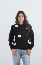 Introducing the Be Different Sweater, a cozy black sweater adorned with white flowers, perfect for adding a touch of charm to your wardrobe. With its soft material, long sleeves, and crew neckline, this sweater offers both comfort and style, making it ideal for any casual outing.

Fabric: 52% Acrylic, 28% Nylon, 20% Polyester

Size Guide: Fits True To Size, Model is Wearing a Size S

Available at our boutiques in Chicago, Lake Geneva, and Milwaukee. (Item availability may vary by location.)