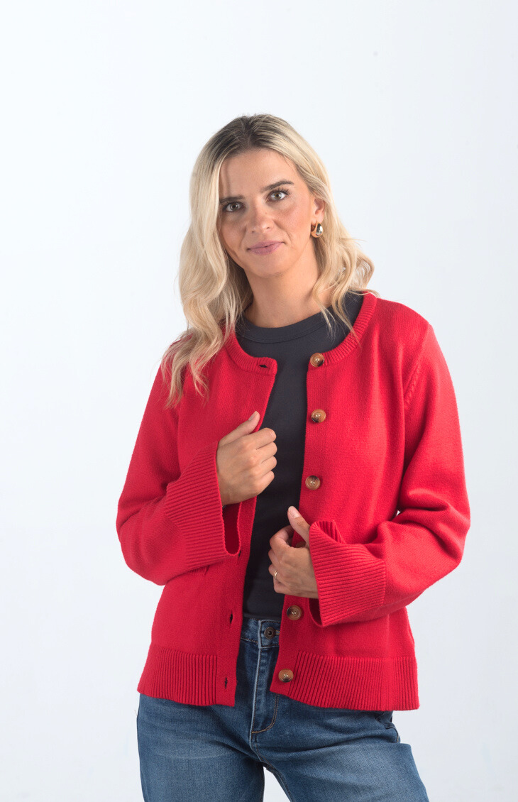 Introducing the Pamelia Wide Sleeve Cardigan, a vibrant red cardigan that effortlessly combines comfort with style. Featuring wide sleeves and a button-up design, this cardigan is perfect for layering and adding a pop of color to your wardrobe.

Fabric: 50% Viscose, 27% Polyester, 23% Polyamide

Size Guide: Fits True To Size, Model is Wearing a Size S

Available at our boutiques in Chicago, Lake Geneva, and Milwaukee. (Item availability may vary by location.)