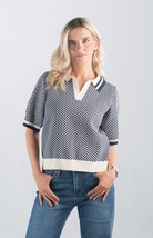 Introducing the Aristotle Top, a refined navy and cream printed top that exudes timeless sophistication. Featuring short sleeves and a classic collar, this top is perfect for elevating your casual or professional wardrobe.

Fabric: 100% Cotton

Size Guide: Fits True To Size, Model is Wearing a Size S

Available at our boutiques in Chicago, Lake Geneva, and Milwaukee. (Item availability may vary by location.)